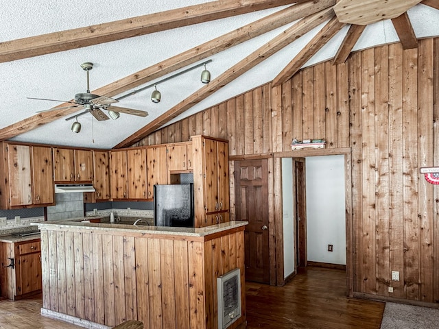 230 Tanglewood Dr, Blue Ridge, GA 30513 - kitchen featuring under cabinet range hood, lofted ceiling with beams, wood finished floors, and freestanding refrigerator