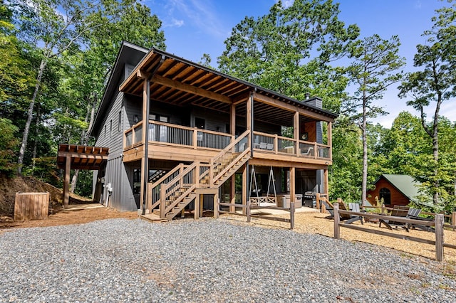 view of front of property featuring a patio area and a deck