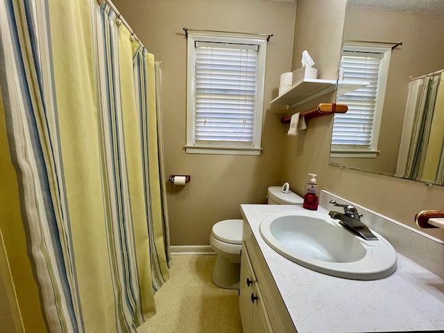 136 Ashe Knob Dr, Hayesville, NC 28904 - full bathroom with vanity, toilet, plenty of natural light, and baseboards