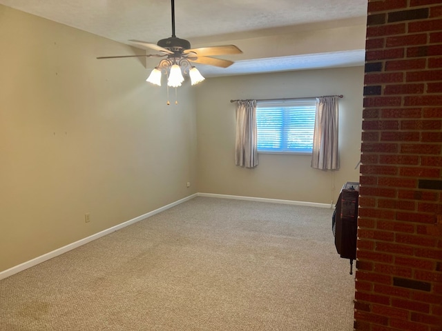 unfurnished room featuring light carpet and ceiling fan