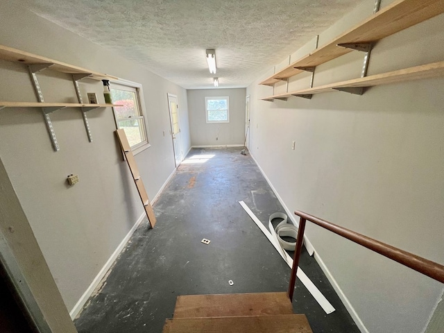 basement featuring a textured ceiling