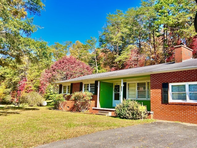 136 Ashe Knob Dr, Hayesville, NC 28904 - single story home featuring brick siding and a front lawn