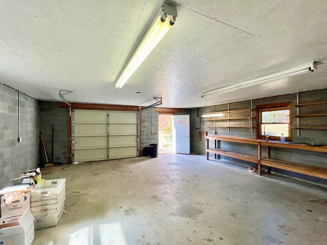 136 Ashe Knob Dr, Hayesville, NC 28904 - garage with concrete block wall and a workshop area