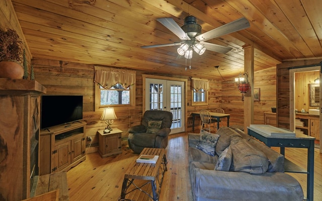 living room featuring light wood-type flooring, french doors, wooden ceiling, and lofted ceiling