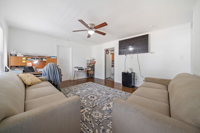 living room with dark wood-type flooring and ceiling fan