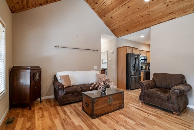 living room with vaulted ceiling, wood ceiling, visible vents, and light wood-style floors