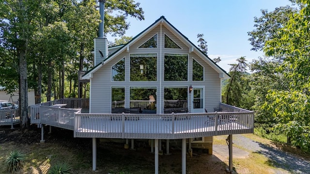 back of property with a wooden deck