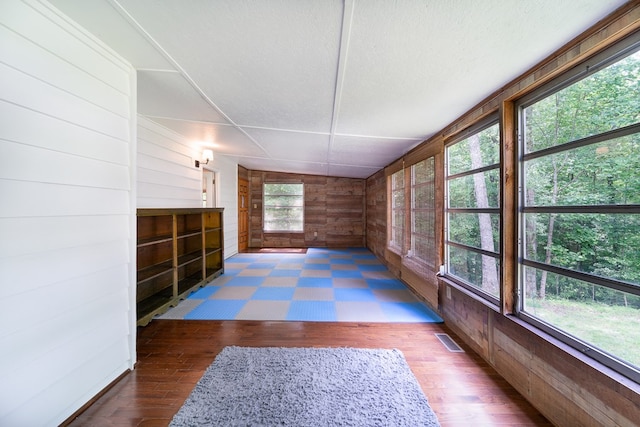 interior space featuring wood walls