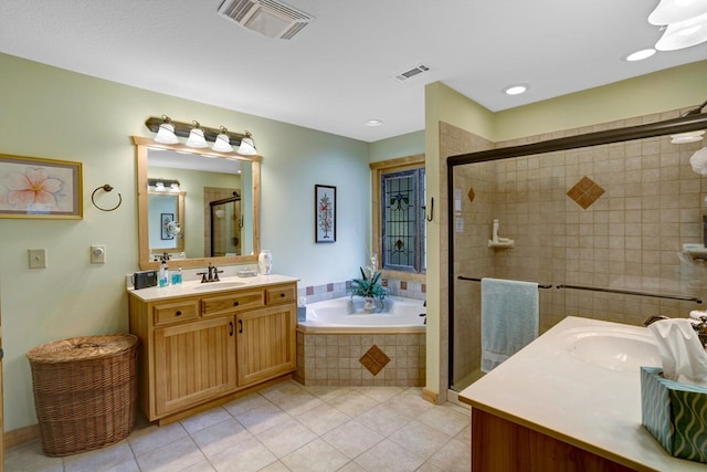 full bath with a sink, visible vents, two vanities, and a shower stall