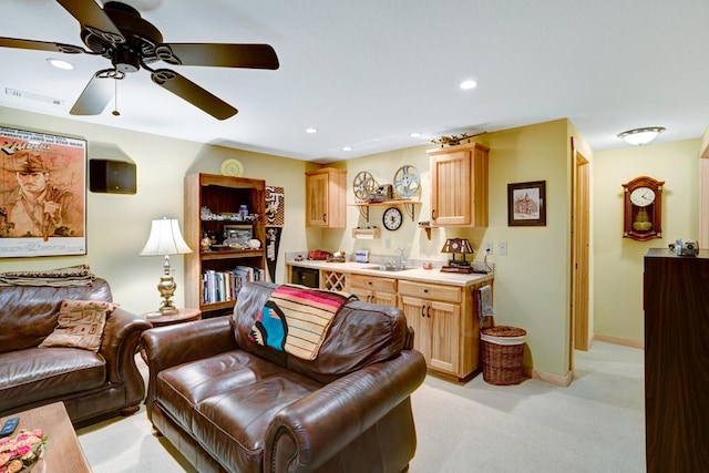 living area with visible vents, baseboards, light carpet, recessed lighting, and a ceiling fan