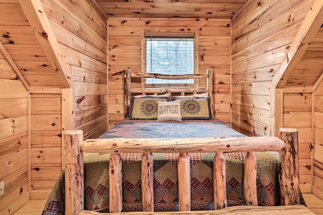 unfurnished bedroom featuring wooden walls and wood ceiling