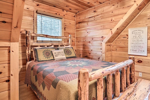 bedroom with wooden walls, wood-type flooring, and wood ceiling