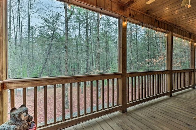 unfurnished sunroom with wooden ceiling