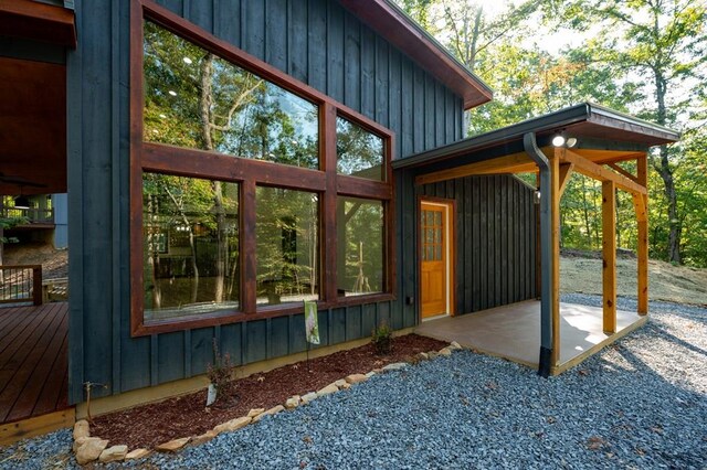 view of side of property featuring a deck