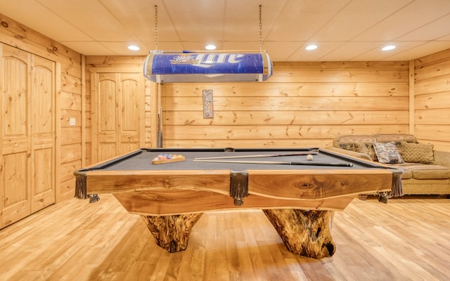 playroom with billiards, a paneled ceiling, and light hardwood / wood-style flooring