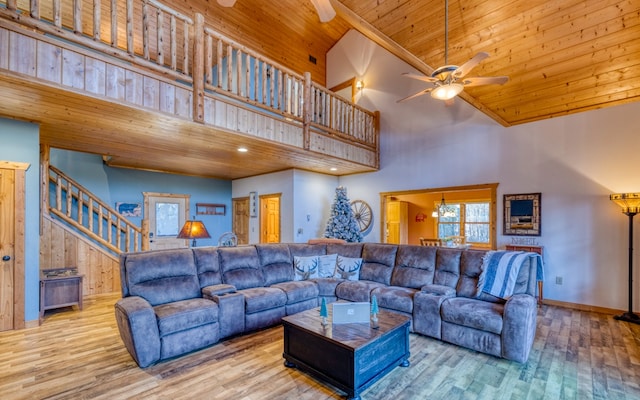 living room with wooden ceiling, high vaulted ceiling, light hardwood / wood-style flooring, and ceiling fan