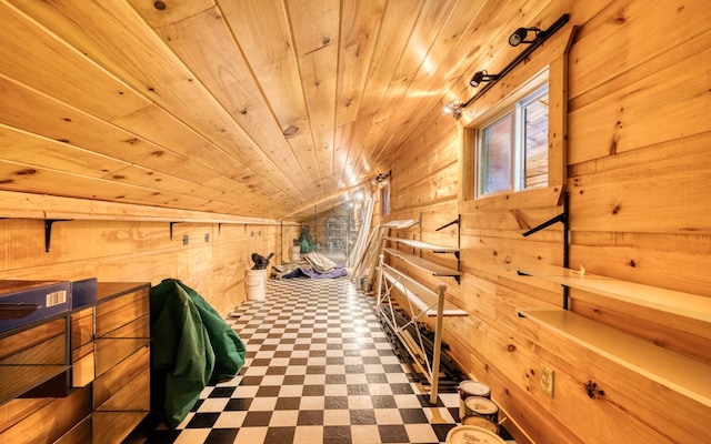 interior space featuring wooden walls, tile flooring, and wood ceiling