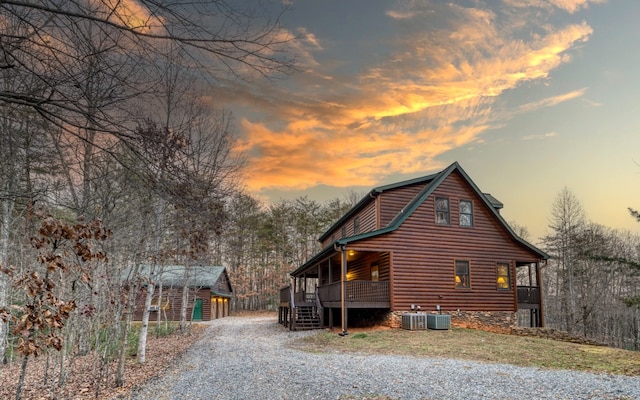 property exterior at dusk featuring central AC