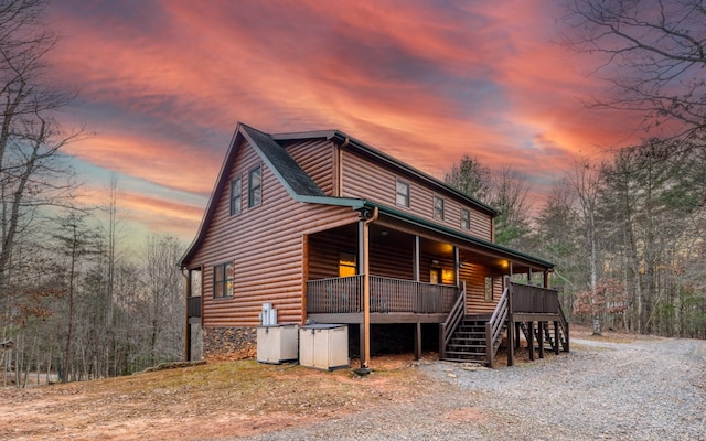 view of back house at dusk