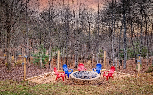 view of yard with a fire pit