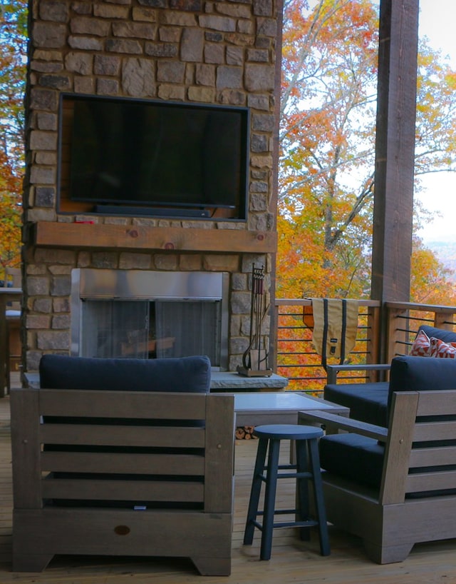 view of patio with an outdoor stone fireplace