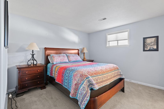 bedroom with light carpet