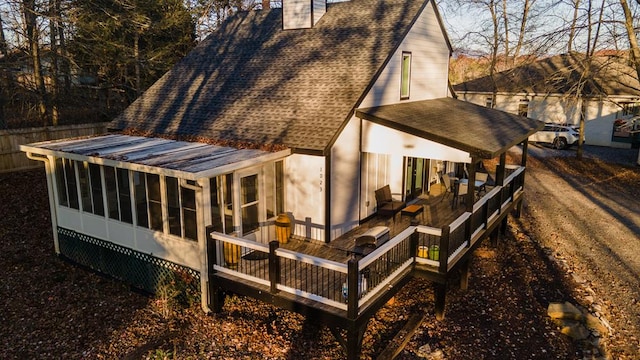 back of property featuring a sunroom