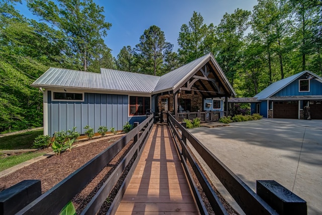 exterior space featuring a porch and a garage