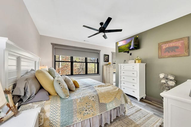 bedroom featuring ceiling fan and light hardwood / wood-style flooring