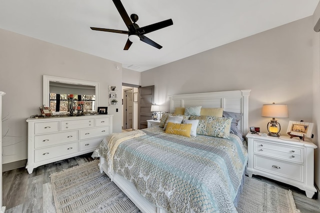 bedroom featuring ceiling fan and dark wood-type flooring