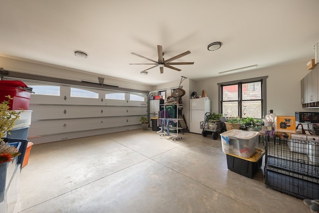 garage featuring white fridge and ceiling fan