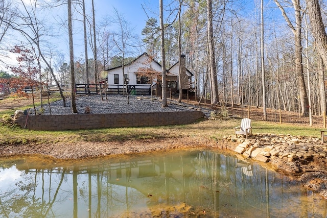 rear view of house with a water view