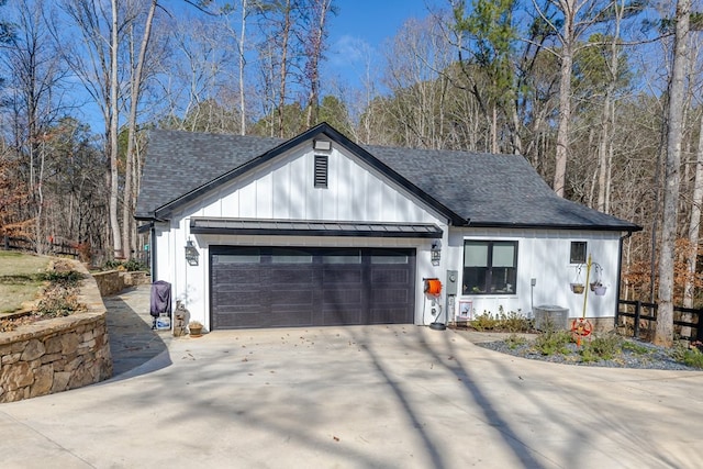 modern inspired farmhouse featuring a garage