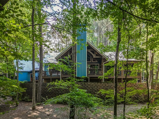 back of property featuring a wooden deck