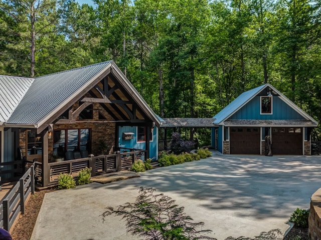 view of front of home with a porch and a garage