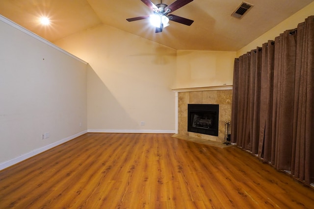 289 12 Point Rd, Blairsville, GA 30512 - unfurnished living room featuring ceiling fan, wood finished floors, a fireplace, lofted ceiling, and baseboards