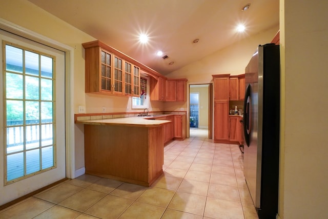 289 12 Point Rd, Blairsville, GA 30512 - kitchen featuring freestanding refrigerator, a peninsula, a sink, glass insert cabinets, and light countertops