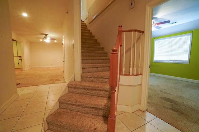 289 12 Point Rd, Blairsville, GA 30512 - staircase with carpet flooring, a ceiling fan, tile patterned flooring, and baseboards