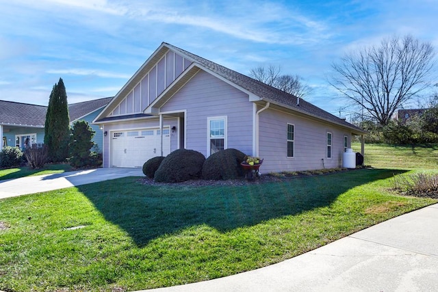 view of property exterior with a garage and a yard