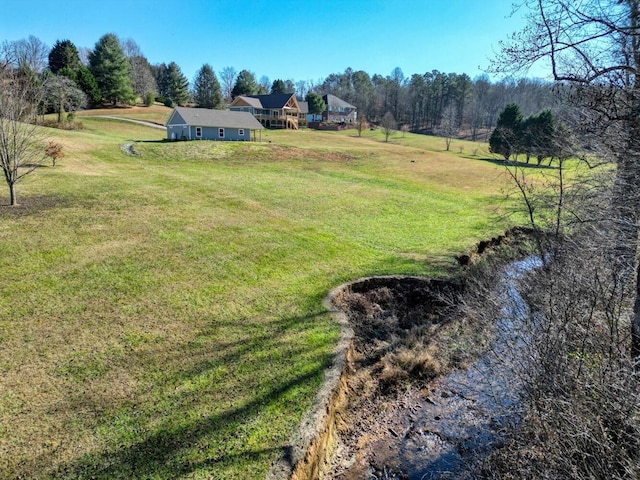 view of yard with a rural view