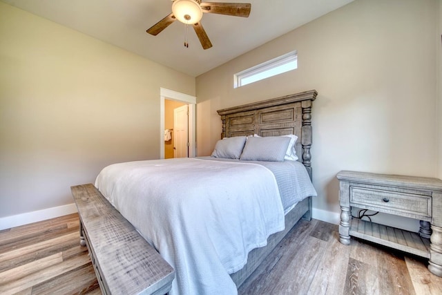 bedroom featuring hardwood / wood-style flooring and ceiling fan