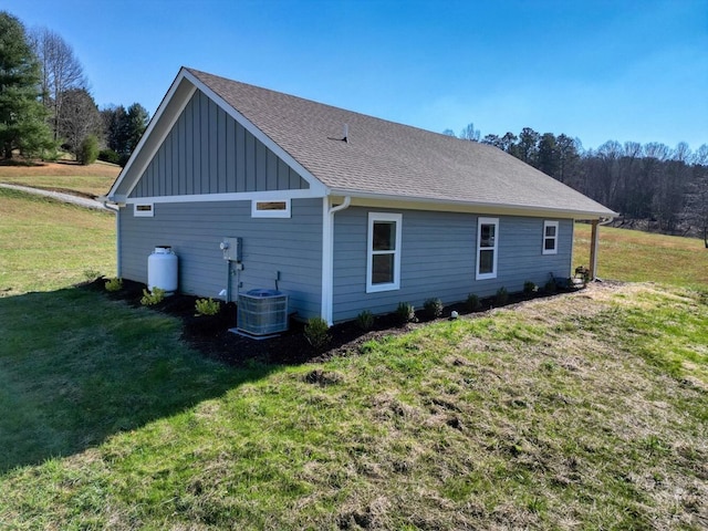 view of side of home featuring a yard