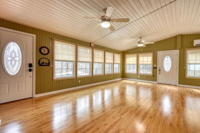 foyer featuring ceiling fan, a wall mounted air conditioner, lofted ceiling, wooden ceiling, and wood finished floors