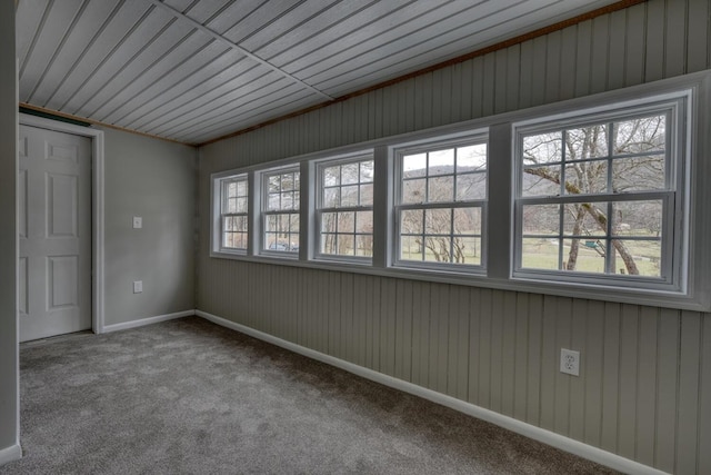 spare room with carpet flooring and baseboards