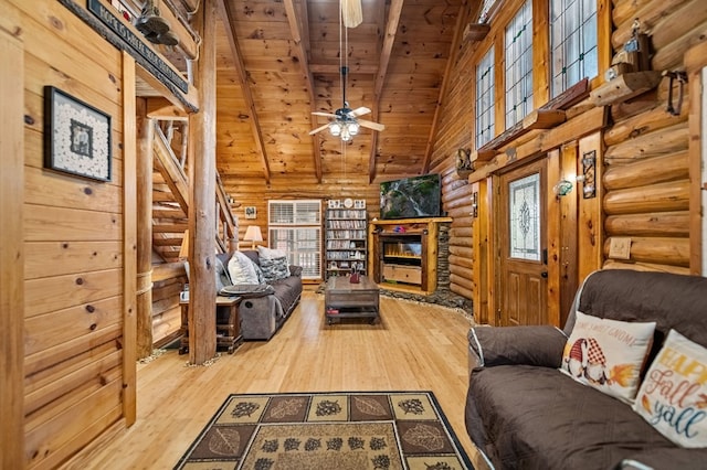 living room with ceiling fan, wood ceiling, lofted ceiling with beams, and hardwood / wood-style floors