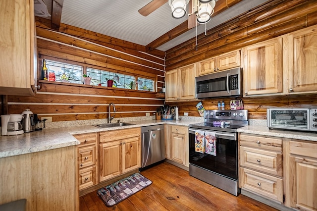 kitchen with ceiling fan, light brown cabinets, sink, stainless steel appliances, and light wood-type flooring