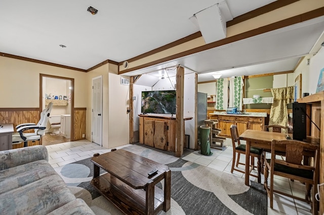 tiled living room featuring wood walls and ornamental molding