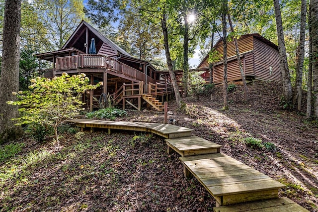 back of property with a wooden deck