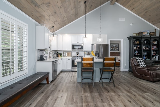 kitchen with sink, white cabinetry, wood ceiling, hanging light fixtures, and appliances with stainless steel finishes