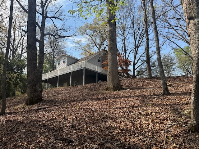 back of property featuring a deck
